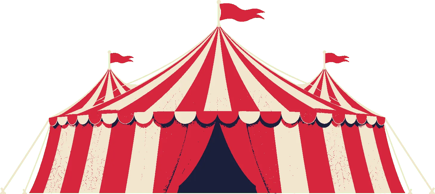 A red and cream striped circus tent at night